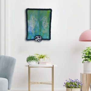living room mockup of original acrylic nautical painting seahorse wall art blue green palette rope frame coastal decor for cottage or beach home