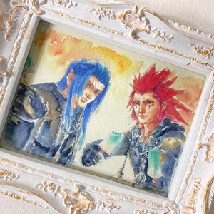 May include: A framed watercolor painting of two anime characters. The character on the left has blue hair and is wearing a dark blue outfit. The character on the right has red hair and is wearing a dark blue outfit. The background is a light yellow with orange and red hues.