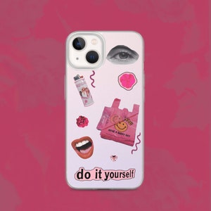 May include: A white iPhone case with a pink and white collage design. The design includes a smiley face, a flower, a lighter, a pair of lips, and an eye. The text "do it yourself" is printed on the bottom of the case.