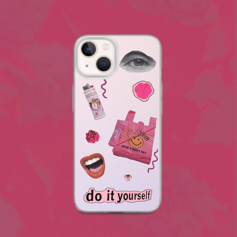 May include: A white iPhone case with a pink and white collage design. The design includes a smiley face, a flower, a lighter, a pair of lips, and an eye. The text "do it yourself" is printed on the bottom of the case.