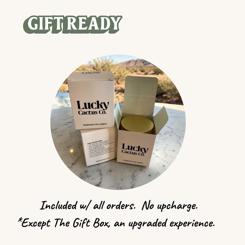 a gift box from Lucky Cactus Co. placed on a marble surface, with a desert landscape visible in the background.
