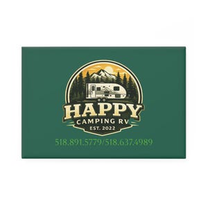 May include: A green rectangular sign features a circular logo with a mountain, trees, and a camper. The logo reads "HAPPY CAMPING RV EST. 2022". Below the logo are two phone numbers in white text.