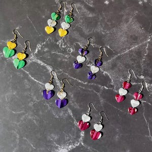 College football earrings! Polymer clay heart earrings in Pacific Northwest College colors. Light-weight, sparkly gift for football lovers.