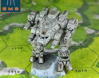 May include: A detailed, gray miniature mech robot with articulated limbs and multiple weapon ports. The model is on a hexagonal game board with number markings. The logo "SMB" is in the upper left corner.