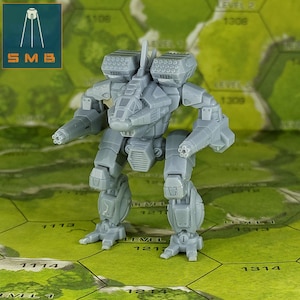 May include: A gray, miniature mech model with detailed weaponry, including missile launchers and arm-mounted cannons. The model stands on a green and tan game board. The logo "SMB" is in the upper left corner.