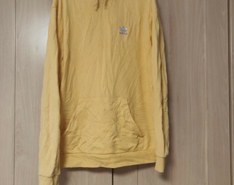 green adidas hoodie yellow logo