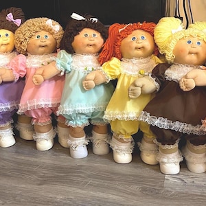 The Classic Lacy Dress Collection for Cabbage Patch Kid Doll, including matching bloomers