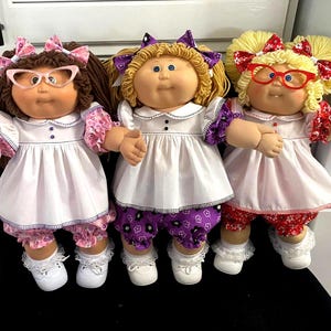 The Classic Pinafore Dress Collection for Cabbage Patch Kid Doll, including matching bloomers