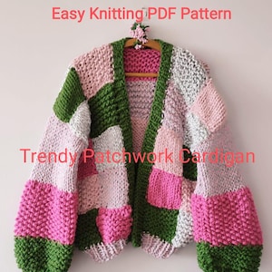 May include: A patchwork cardigan in shades of pink, green, and gray hangs on a wooden hanger. The chunky knit sweater features a color block design with the text "Easy Knitting PDF Pattern" and "Trendy Patchwork Cardigan".