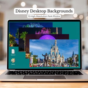 May include: A silver laptop displays a desktop with multiple Disney park photos. The screen shows a teal background with images of a castle, fireworks, and other park scenes. Text at the top reads "Disney Desktop Backgrounds" and "15 High-Resolution Park Photos."