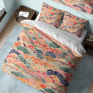 May include: A colourful duvet cover with a repeating pattern of overlapping, stylised waves in shades of pink, blue, green, yellow, and orange. The duvet cover is made of soft, comfortable fabric and features a unique, modern design.