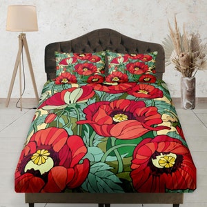 May include: A red and green floral duvet cover with a poppy flower pattern. The duvet cover is on a bed with a brown headboard.