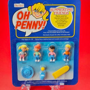May include: A vintage Bluebird "OH PENNY!" Summertime Friends mini playset. The package features four small dolls named Penny, Lucy, Morag, and Robin, with accessories. The packaging is blue with yellow and white text and graphics, and is suitable for ages 4-10.