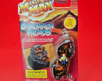Mighty Max Shrunken Heads Rock Monster sellado en su embalaje original
