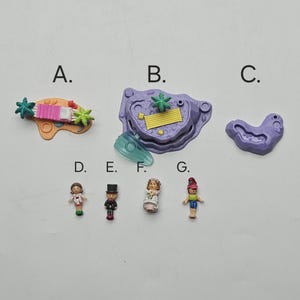 May include: A selection of small plastic toys, including a pink and orange beach scene, a purple pool, and miniature figures of people. The toys are brightly coloured and appear to be part of a playset.
