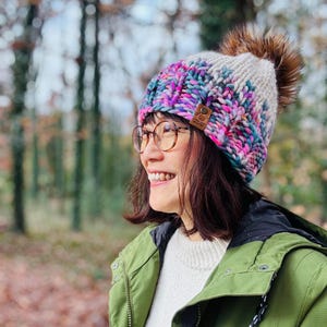 HandKnit Merino Wool Beanie: Pink and White Dancing Lights Design with Faux Fur Pom