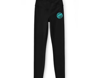 Leggings negros para mujer, cintura alta con tiras cruzadas en la parte delantera y detalle de espiral en la cadera.