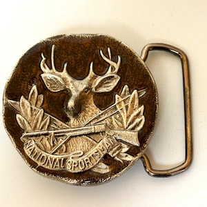 Vintage National Sportsman Belt Buckle – Deer with Rifle Design – Collectible Hunting Memorabilia – Marked 976 – 2-1/4” Diameter