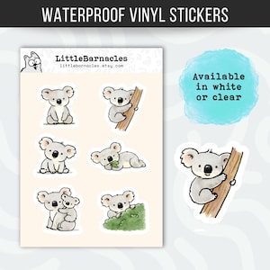 May include: A sheet of waterproof vinyl stickers featuring six illustrated koalas in various poses, including sitting, climbing a tree, and eating leaves. The text reads WATERPROOF VINYL STICKERS, LittleBarnacles, and Available in white or clear.