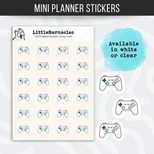 May include: Mini planner stickers featuring a video game controller design. The stickers are in a grid pattern on a cream-colored background. The controllers have a black outline with blue, green, and pink accents. Text on the image says "Available in white or clear".