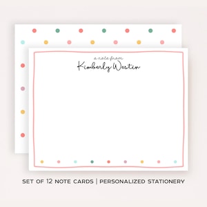 May include: A set of white note cards featuring a pink hand-drawn border and the black text a note from Kimberly Westin. The cards are decorated with a pattern of small multicolored polka dots in shades of pink, yellow, teal, and orange.
