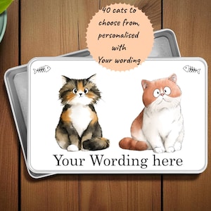 May include: A rectangular metal tray with a white surface featuring two cartoon cats. The cats are a calico and a ginger tabby. The text reads "40 cats to choose from, personalised with Your wording here."
