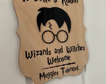 May include: A wooden sign with a Harry Potter theme. It says "Isabelle's Room" with a silhouette of Harry Potter wearing glasses. The sign also says "Wizards and Witches Welcome" and "Muggle Tolerated".