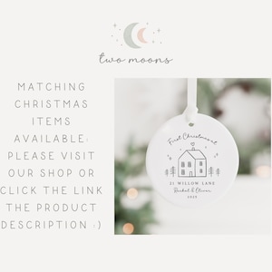 May include: White ceramic Christmas ornament with a house illustration and the text "First Christmasal." The ornament also includes the address "21 Willow Lane" and the names "Rachel & Oliver" with the year "2025."