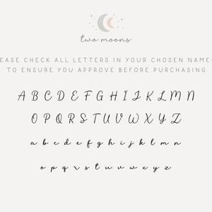 May include: A beige background with the text "two moons" and a cursive alphabet chart. The chart includes uppercase and lowercase letters from A to Z, with the text "PLEASE CHECK ALL LETTERS IN YOUR CHOSEN NAME(S) TO ENSURE YOU APPROVE BEFORE PURCHASING".