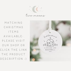 May include: White ceramic Christmas ornament with a house illustration and the text "First Christmasal". The ornament also includes the address "21 Willow Lane" and the names "Rachel & Oliver" with the year "2025".
