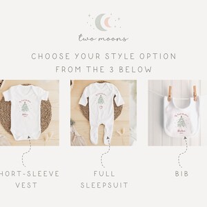 May include: White baby clothing set with a Christmas tree design. The set includes a short-sleeve vest, a full sleepsuit, and a bib. The text "My First Christmas" is printed on each item, along with a name.