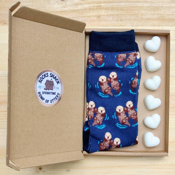 Romp of otters holding hands in the river mens socks & hand made vegan soy wax melts fragrance of choice free p+p uk Recyclable packaging