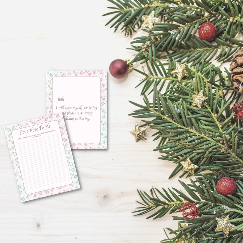 May include: A printable love note template with a pink and blue snowflake design. The note says "Love Note To Me" and includes a quote: "I will open myself up to joy and pleasure at every holiday gathering."