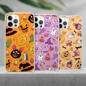 May include: Three clear phone cases with Halloween-themed designs. The cases feature various spooky and festive elements, including ghosts, pumpkins, bats, and candy corn. The cases are all in a clear plastic material and have a white border around the design.