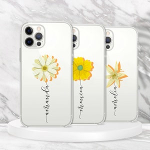 May include: Three clear phone cases with floral designs and names "Amanda", "Monica", and "Amelia" written on them.