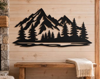 May include: A black metal wall art piece featuring a silhouette of a mountain range with jagged peaks and a dense forest of pine trees at the base, positioned above a horizontal line representing a body of water or a flat landscape.