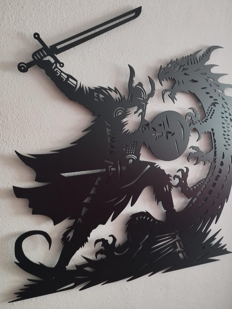 May include: Black metal wall art depicting a warrior with a sword and shield fighting a dragon.