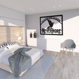 May include: Black metal wall art featuring a raven with the text "Quoth the Raven, Nevermore". The art is hanging on a white wall in a bedroom setting.