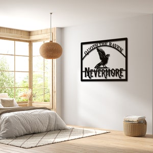 May include: Black metal wall art featuring a raven with the text "Quote the Raven Nevermore".