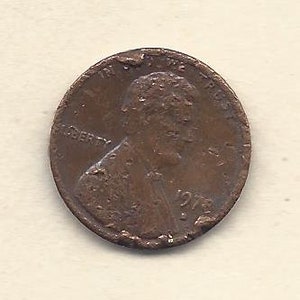 May include: A close-up of a copper-coloured 1972 Lincoln penny. The coin shows the profile of Abraham Lincoln, the word "LIBERTY", and the inscription "IN GOD WE TRUST". The year "1972" is visible.