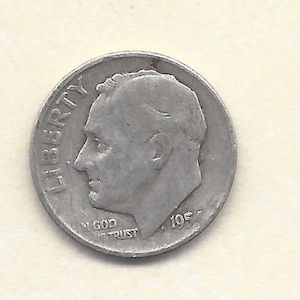 May include: A silver dime coin showing a man's profile, with "LIBERTY" at the top and "IN GOD WE TRUST" below. The year "195-" is visible on the right side. The coin is set against a light background.