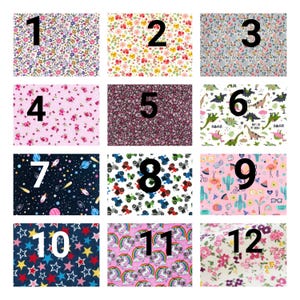 May include: A grid of twelve fabric swatches featuring various patterns including floral prints, dinosaurs, space themes, tractors, flamingos, stars, and unicorns, each labeled with a large black number from one to twelve for identification.