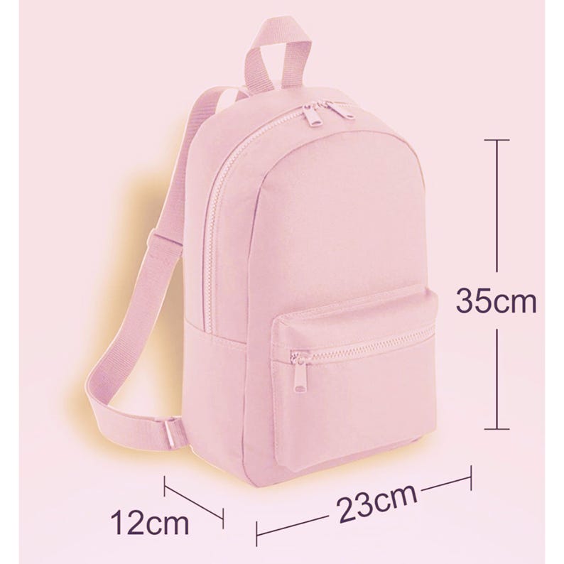 May include: A light pink canvas backpack with a zippered front pocket. The backpack measures 12 inches wide, 23 inches long, and 35 inches tall.