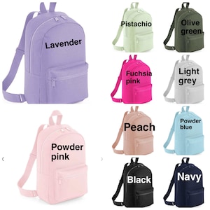May include: A set of ten mini backpacks in various colors, including lavender, pistachio, olive green, fuchsia pink, light grey, peach, powder blue, powder pink, black, and navy. Each backpack has a zipper closure and adjustable straps.
