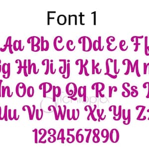 May include: A digital display of Font 1 featuring the full alphabet in uppercase and lowercase letters, along with the numbers 0 through 9. The characters are rendered in a bold, magenta, cursive script style against a plain white background.