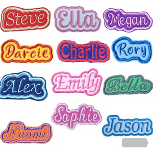 May include: A set of 12 colourful iron-on name patches with various names including Steve, Ella, Megan, Darcie, Charlie, Rory, Alex, Emily, Bella, Sophie, Naomi, and Jason.