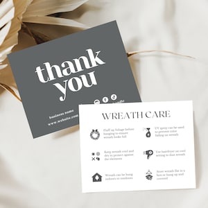 May include: Two cards with text. The first, a dark gray square, reads "thank you" in large white letters, with a business name and website address below. The second card, white, details "WREATH CARE" instructions with icons.
