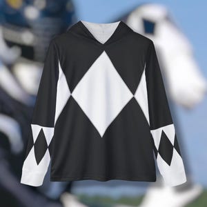 May include: Black long-sleeve hoodie with a white diamond pattern on the front and sleeves. The hoodie has a drawstring hood.