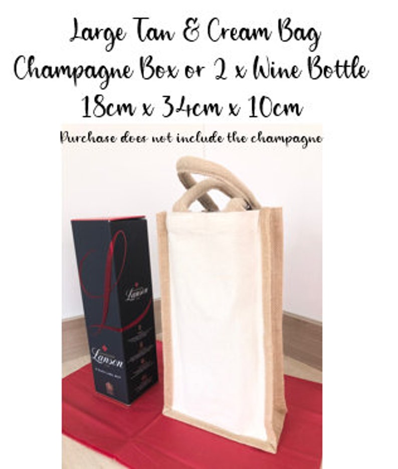 May include: A large tan and cream jute bag with a handle. The bag is 18 inches by 34 inches by 10 inches and can fit a champagne box or two wine bottles. The text "Large Tan & Cream Bag" is printed on the top of the image. The text "Champagne Box or 2 x Wine Bottle" is printed below the first line of text. The text "18cm x 34cm x 10cm" is printed below the second line of text. The text "Purchase does not include the champagne" is printed below the third line of text.