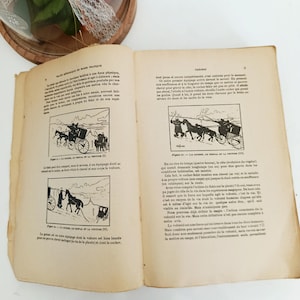 May include: Open book with French text and illustrations of horse-drawn carriages. The pages are aged with a yellowed tone. The illustrations depict a coachman and horses. The book is open to a double-page spread.